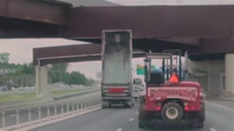 dump truck hits bridge ga